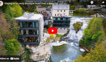Neem een kijkje in een luxe boutiquehotel boven een waterval