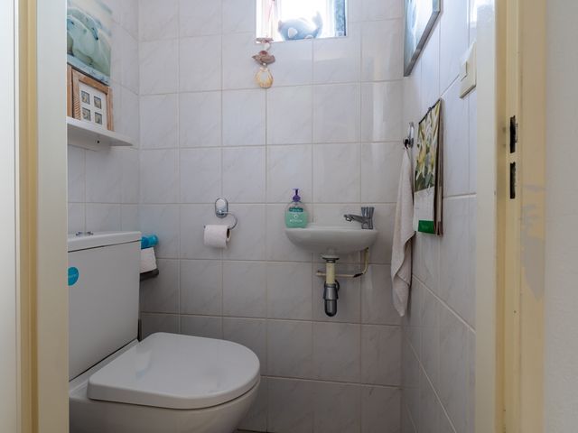 Kamille 23, Sprang-Capelle