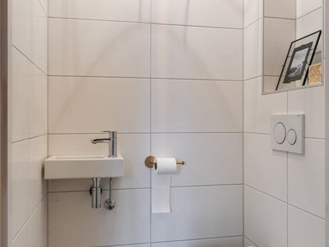 Tiengastraat 8, Opende